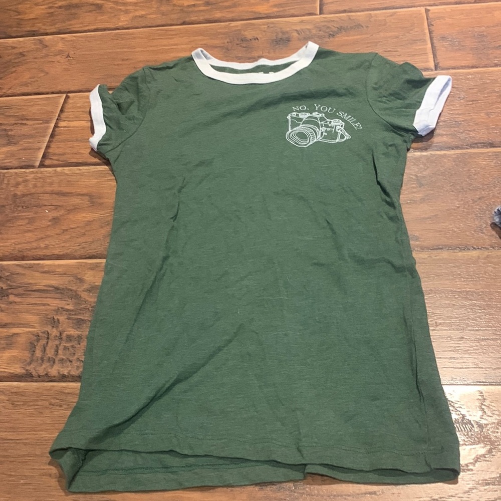 green top with small design & saying